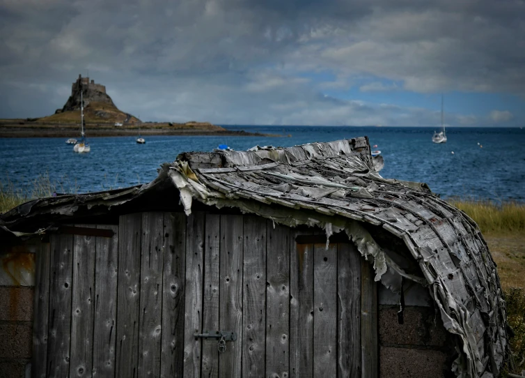 a shed that is sitting next to a large body of water