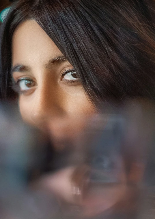 a close up s of a woman's face with her head held up