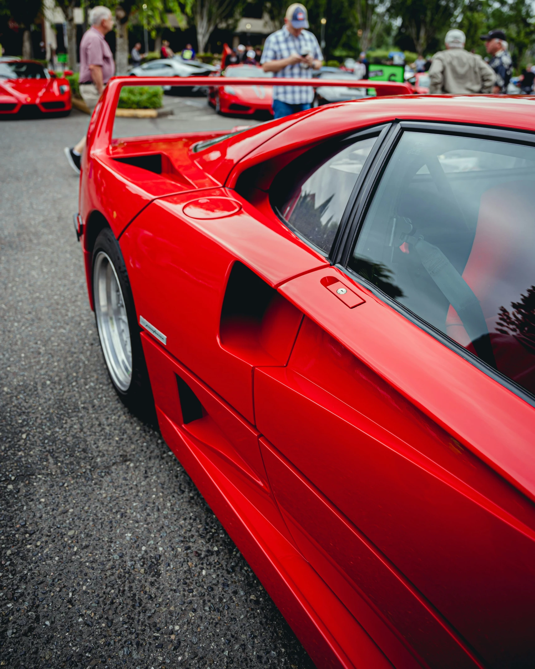 the side of a red sports car on the street