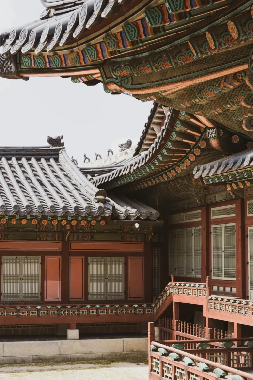 a building with wooden doors and windows in it