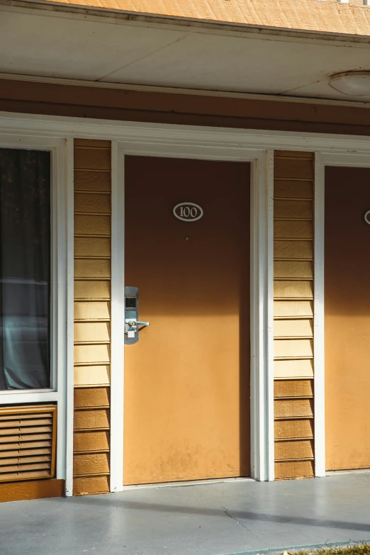 a house with three doors and a clock