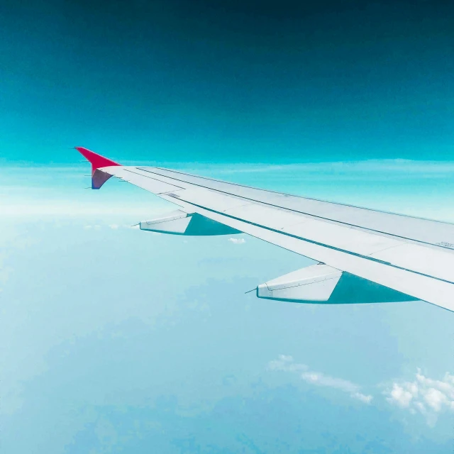 the view from an airplane, looking down on the wing