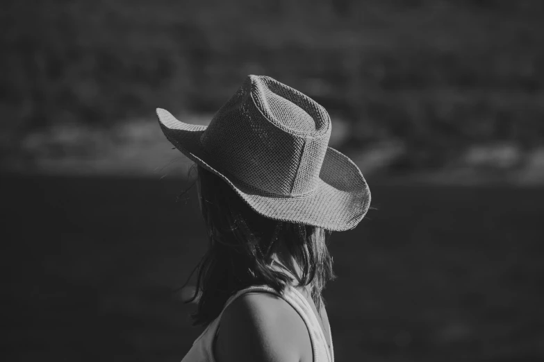 a woman with a hat and long hair