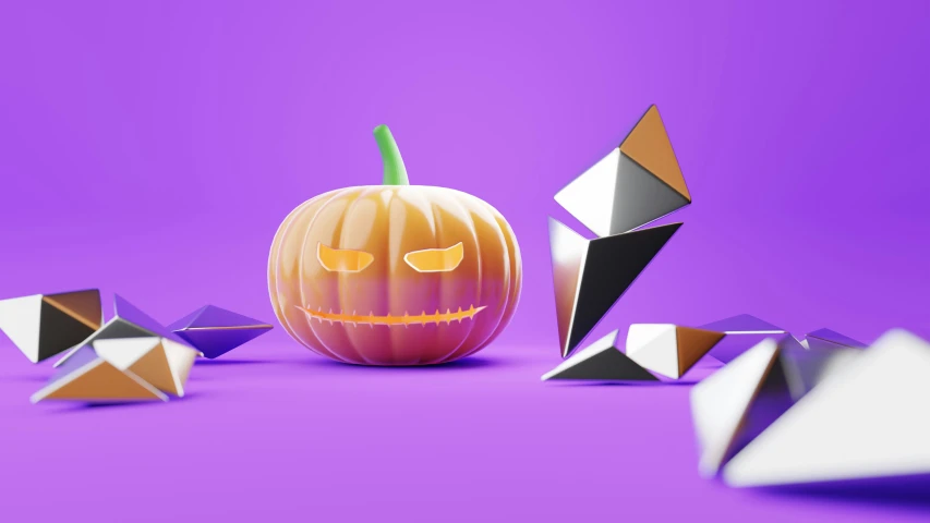 a pumpkin next to origami figures