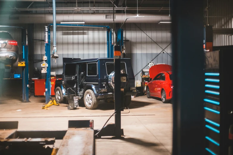 a garage with an automobile being worked on