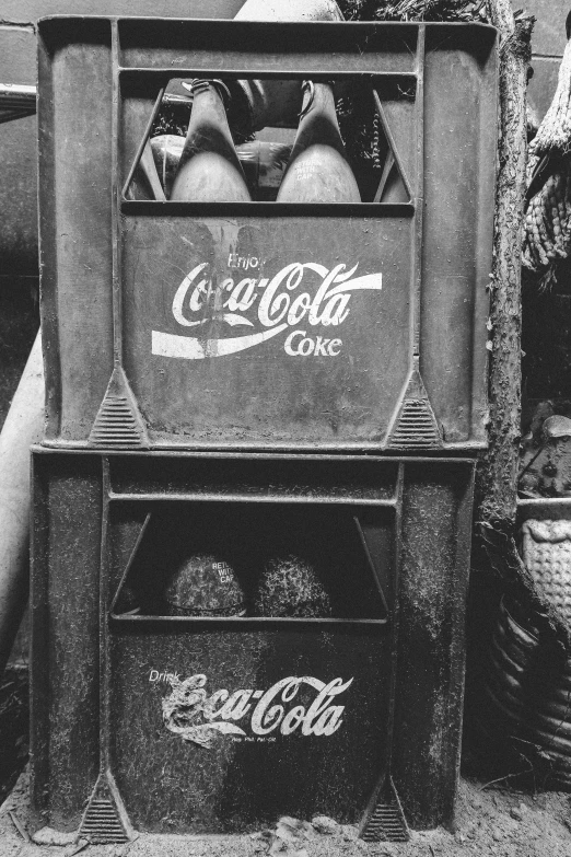 a man and woman standing near a cart that has three soda bottles in it