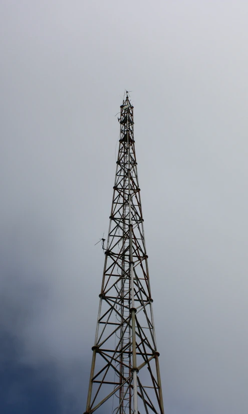 the very tall tower is near the air traffic controller