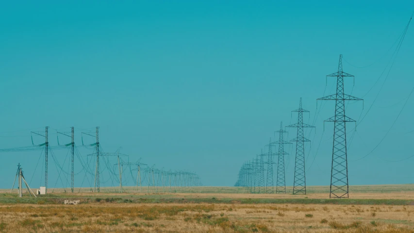 some telephone poles in the middle of a desert