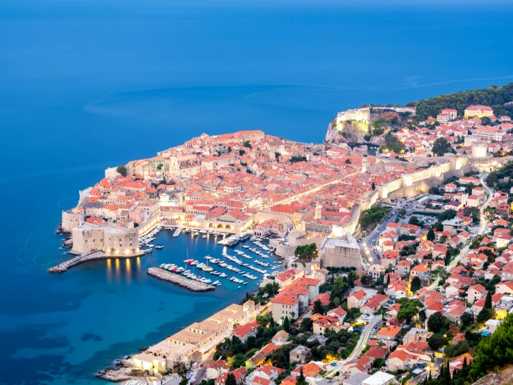 a view of a town that has some boats docked to it