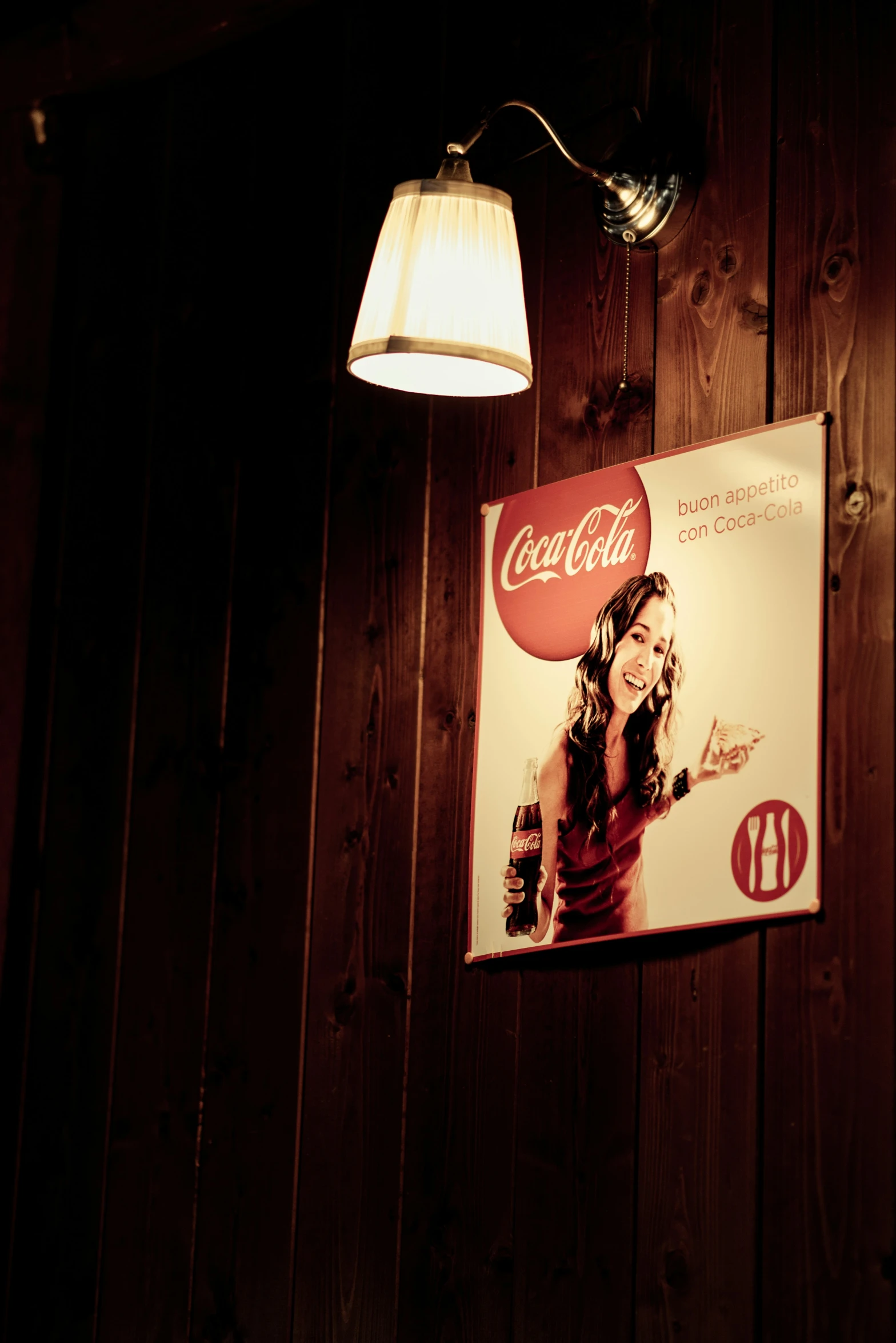 the light bulb is turned on the wood paneling in this restaurant