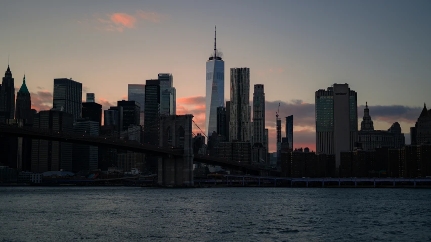 a large city on the side of a bridge