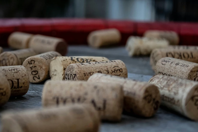 several wine corks are being sorted and placed on a table