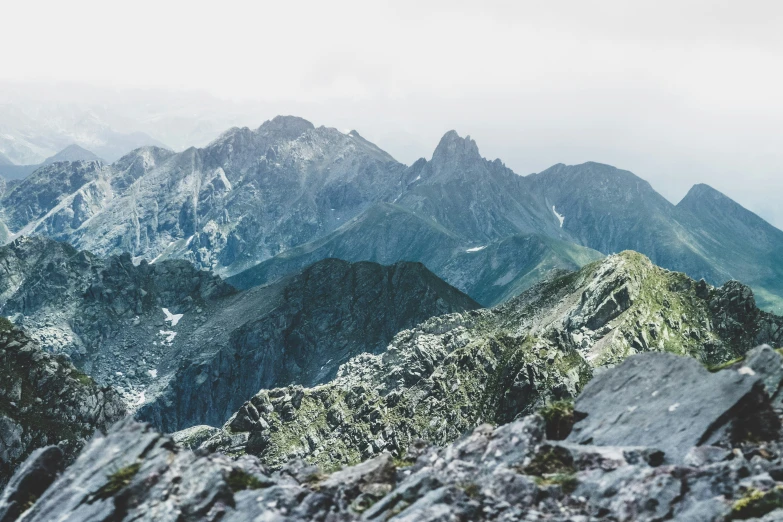 there are several mountains that appear to be overcast