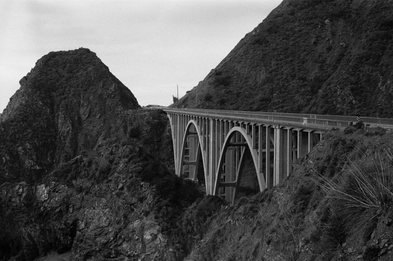 a very large bridge over a big mountain side