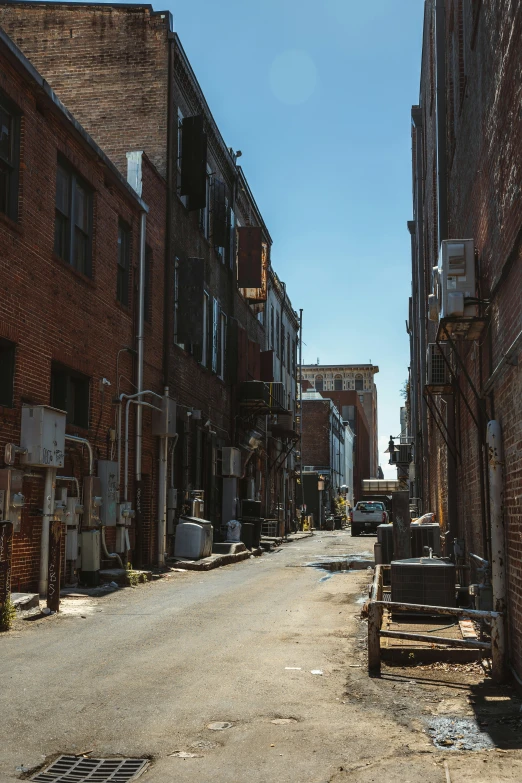 an old road surrounded by brick buildings and other architecture