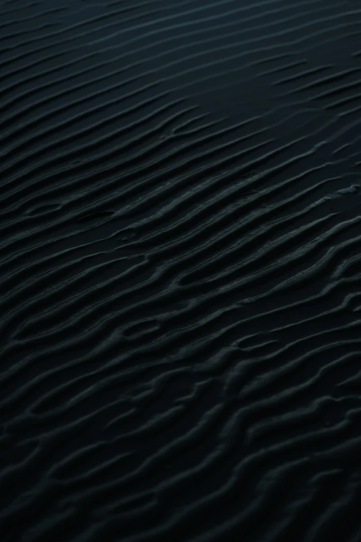 a black sand dune has no lines or waves