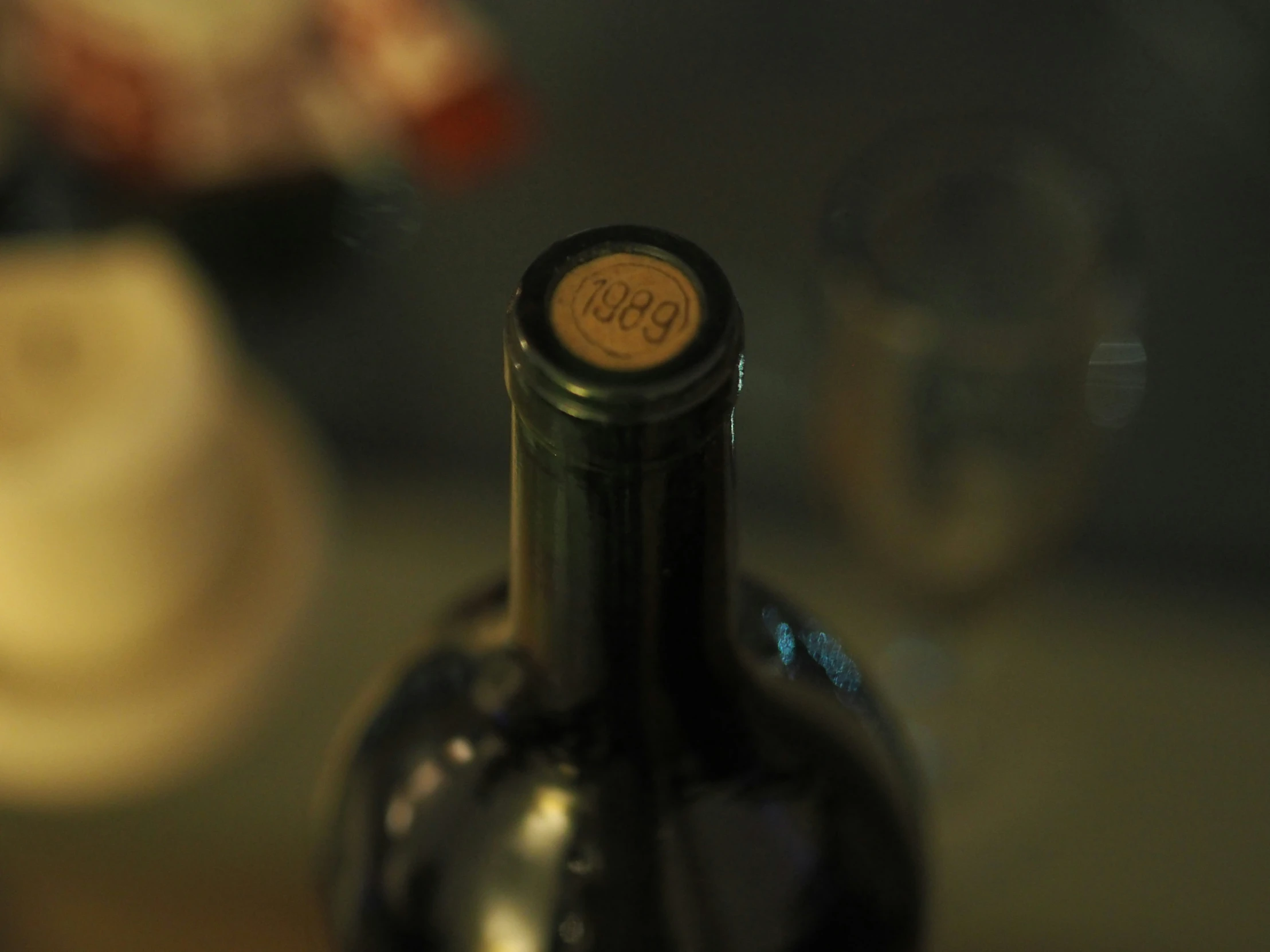 the black bottle has an old cork stopper