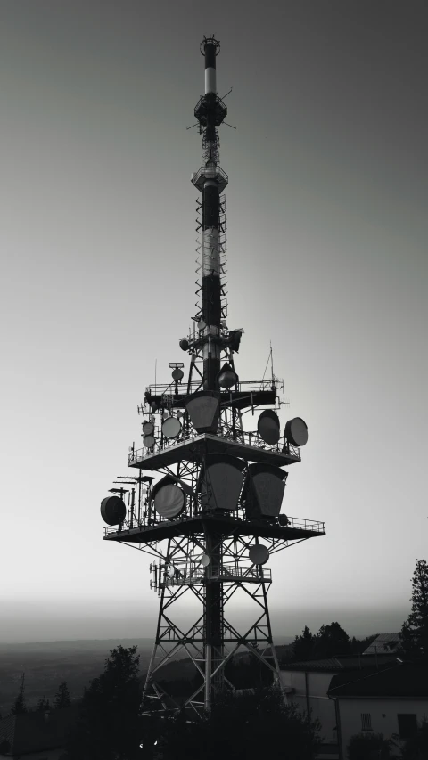 the antenna tower has multiple antennas on top of it