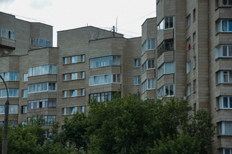 a very tall brown building with lots of windows