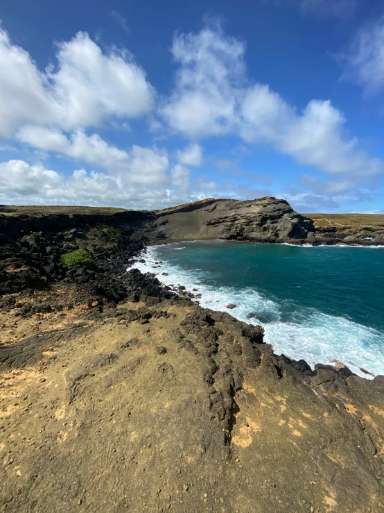 the water is azure and blue with clouds