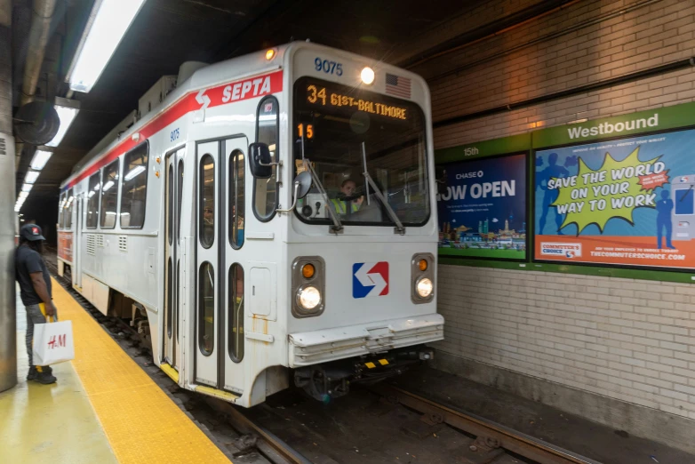 a train is pulling up to a subway stop