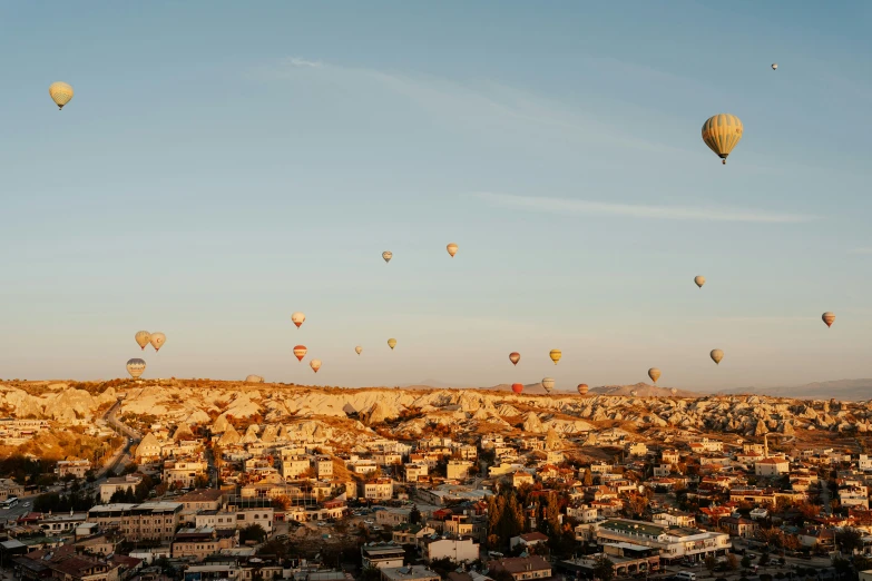 many  air balloons flying over the city