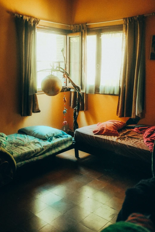 two single beds are pictured in a room