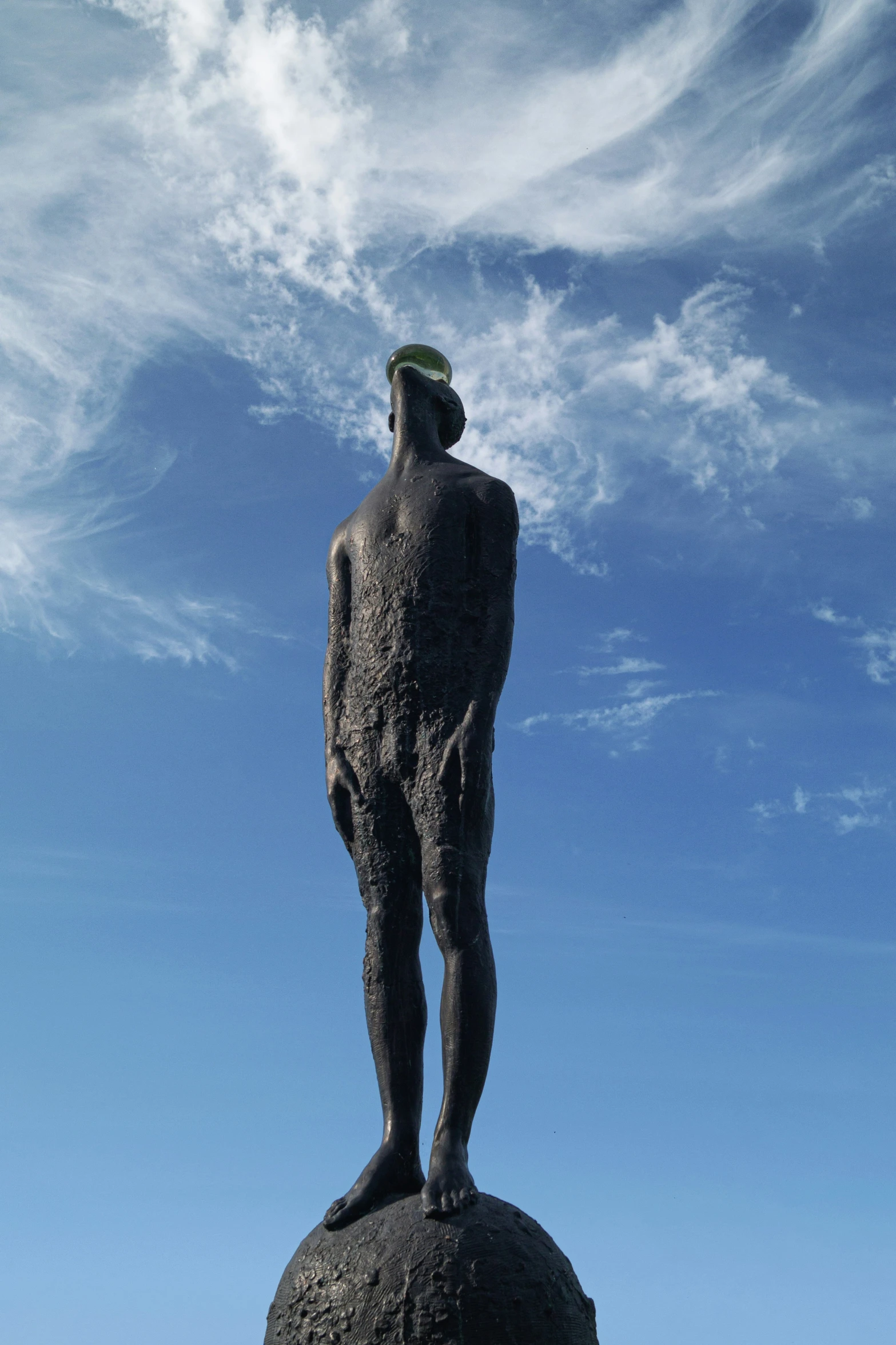 a man that is standing on top of a rock