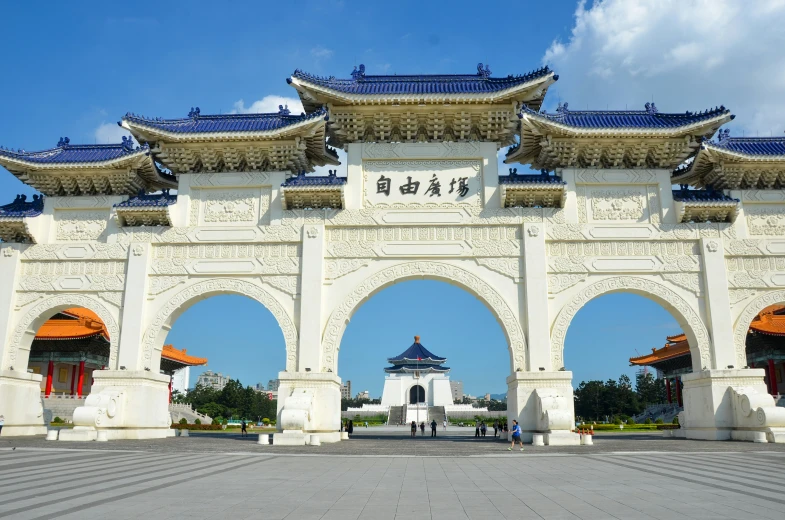 the gate to an open area with arches over it