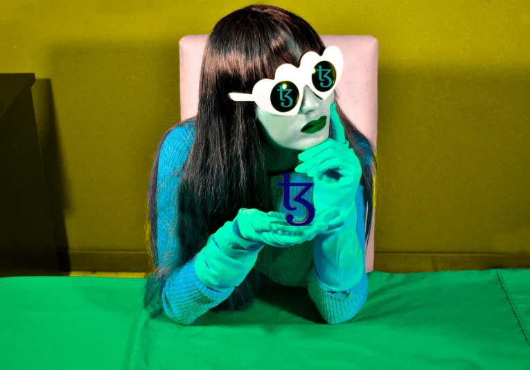 an artistic pograph of a woman wearing green eye makeup