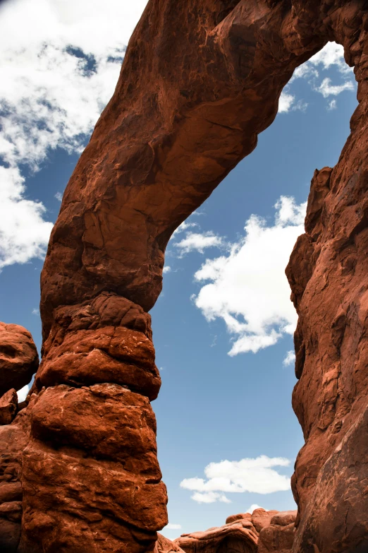 a rock arch and a body of water