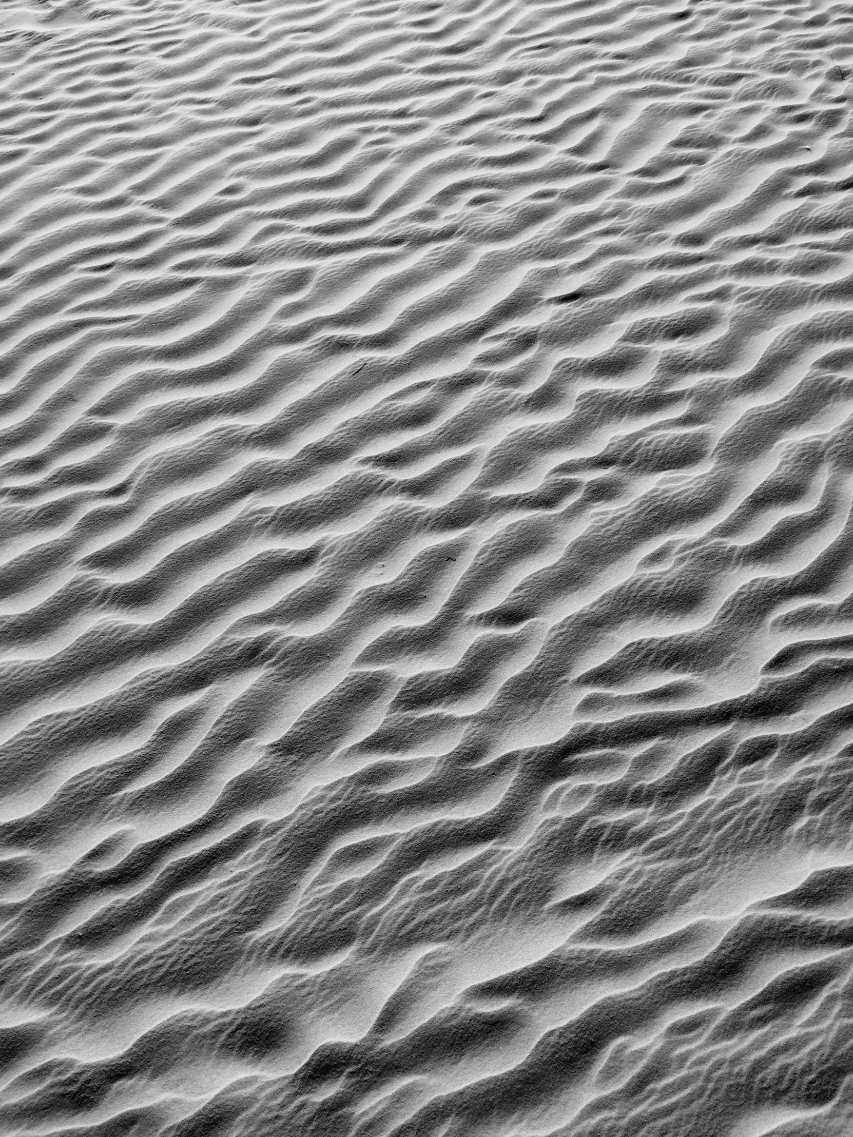 the beach sand has very little lines