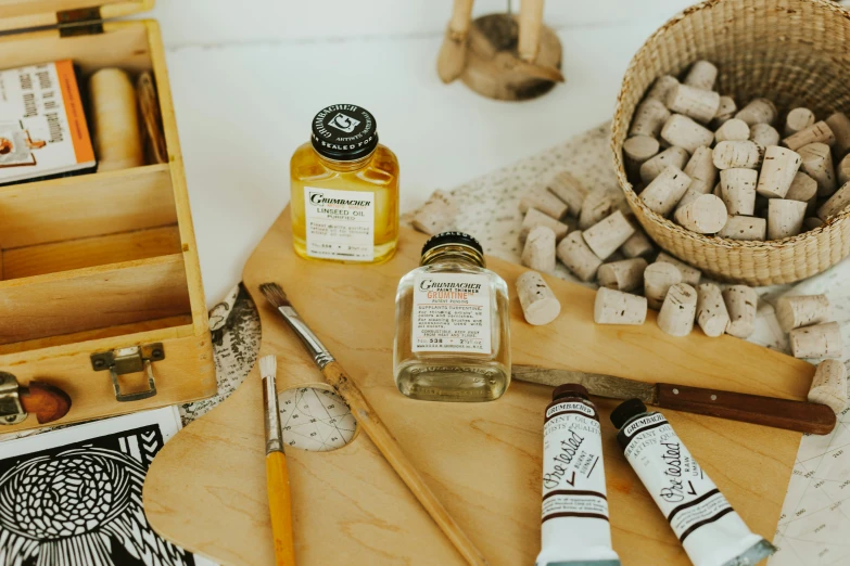 the wooden board with writing utensils, including honey and pen