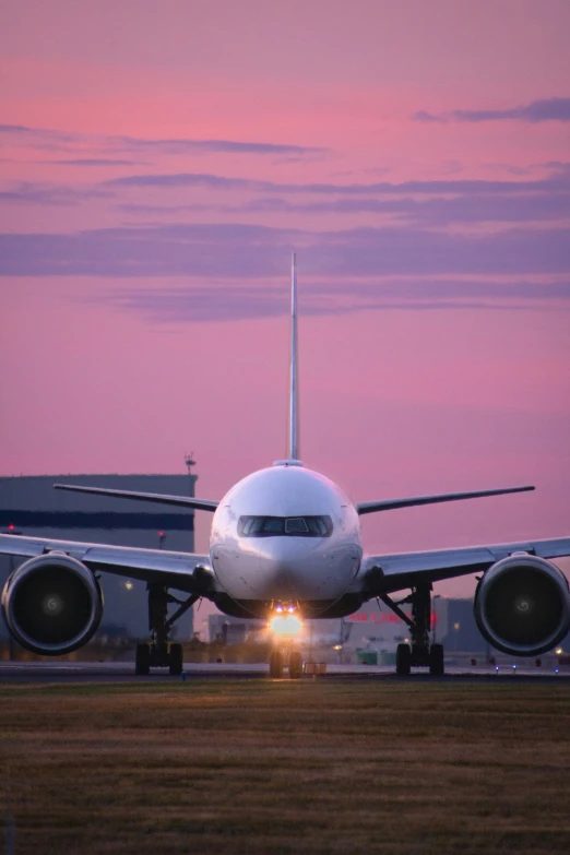 a airplane parked on the tarmac with its landing gear down