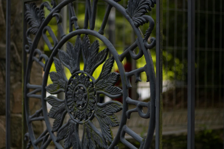 the black iron is attached to the gate of the building