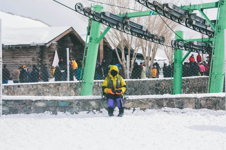 a man is holding a ski pole in the snow