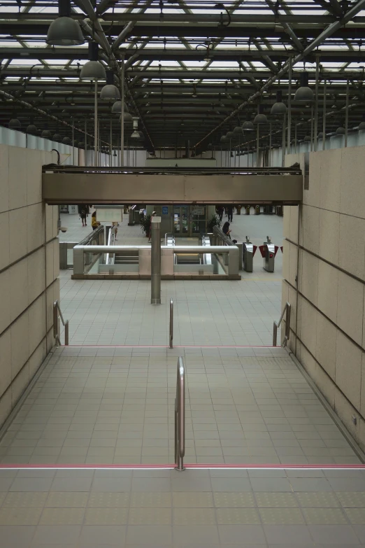 empty building with stairs in it and benches inside