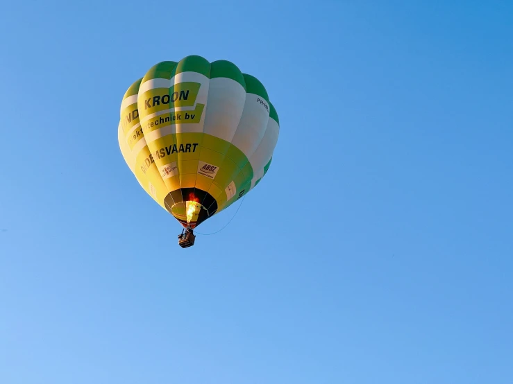 a large balloon with two people sitting on it