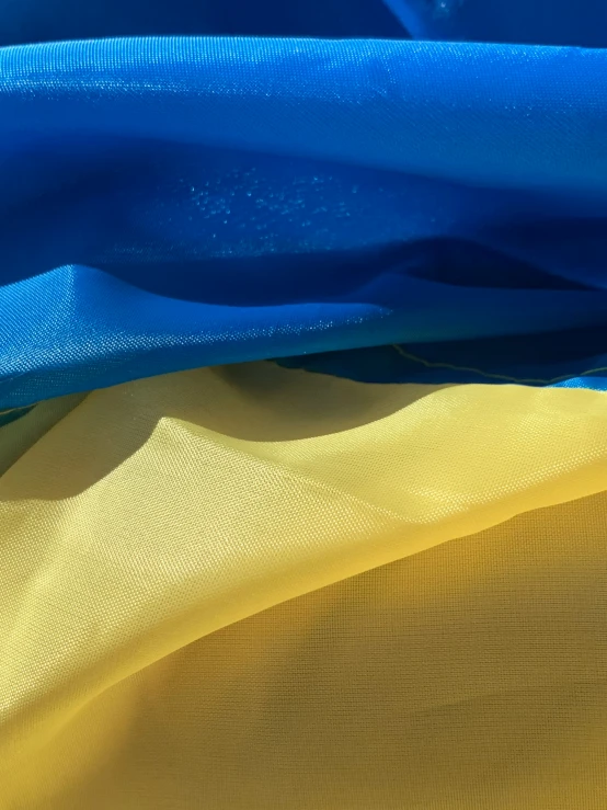 a blue and yellow fabric are close together