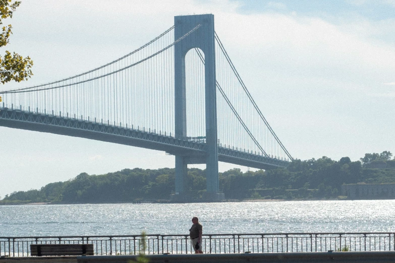 a tall bridge with a person walking on it