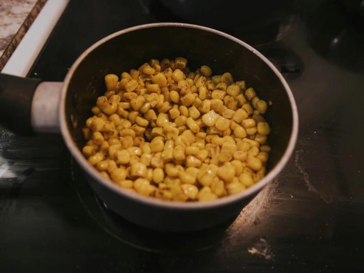 a pan filled with cooked food on a stove