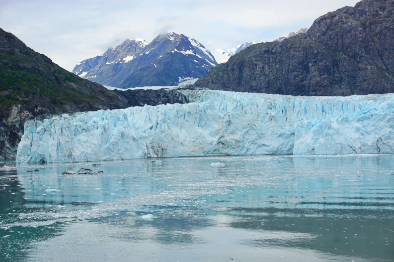 a glacier with large blue chunks of ice on it