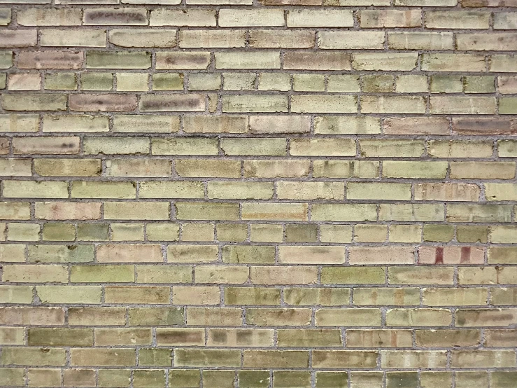 a large brick wall with different types of bricks on it