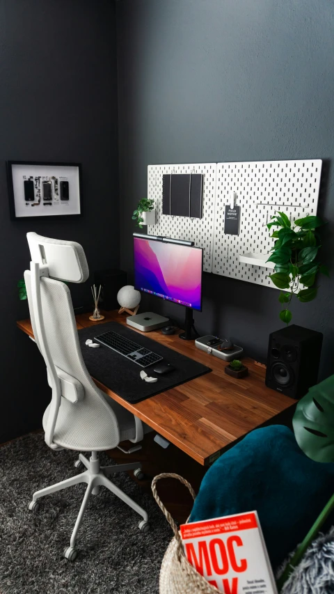 a desktop computer sitting on top of a wooden table