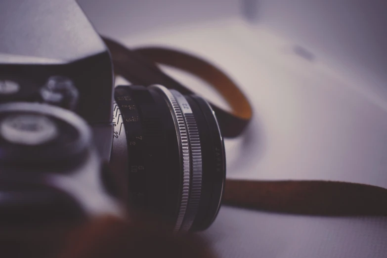 a close up of a camera sitting on the ground