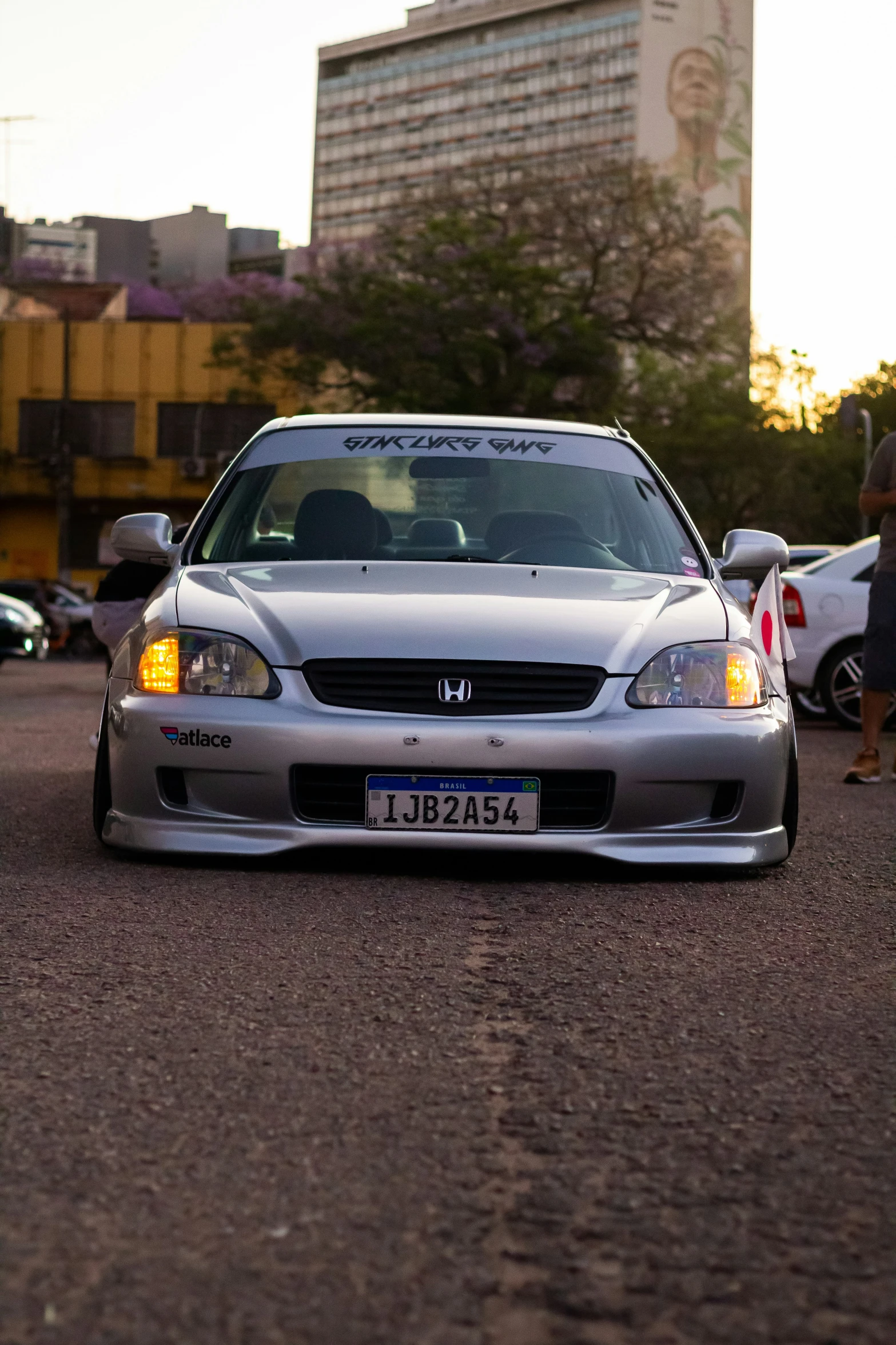 a car is parked on the side of the street