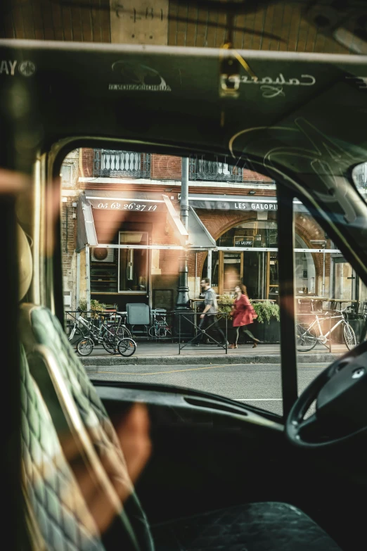 a man is riding in the backseat of a vehicle