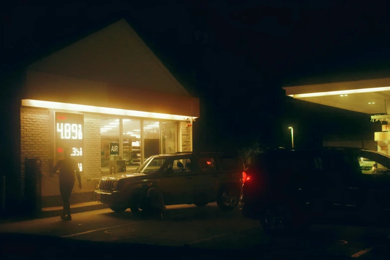 the man is standing in front of his car