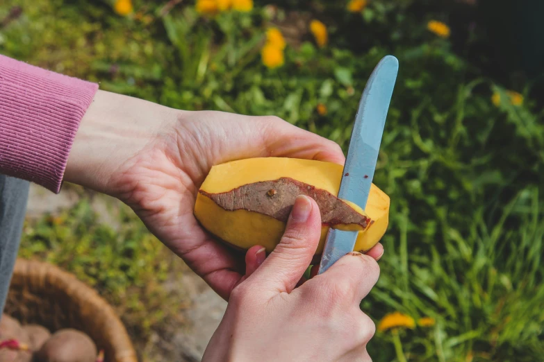 a person is  a banana with scissors