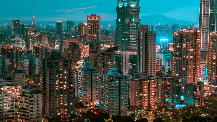 the night view of large city buildings with lit up skyscrs